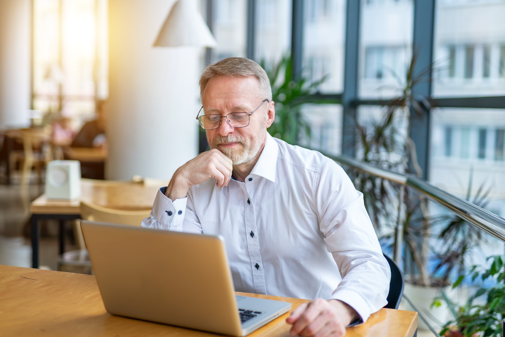 Man smiling at his computer